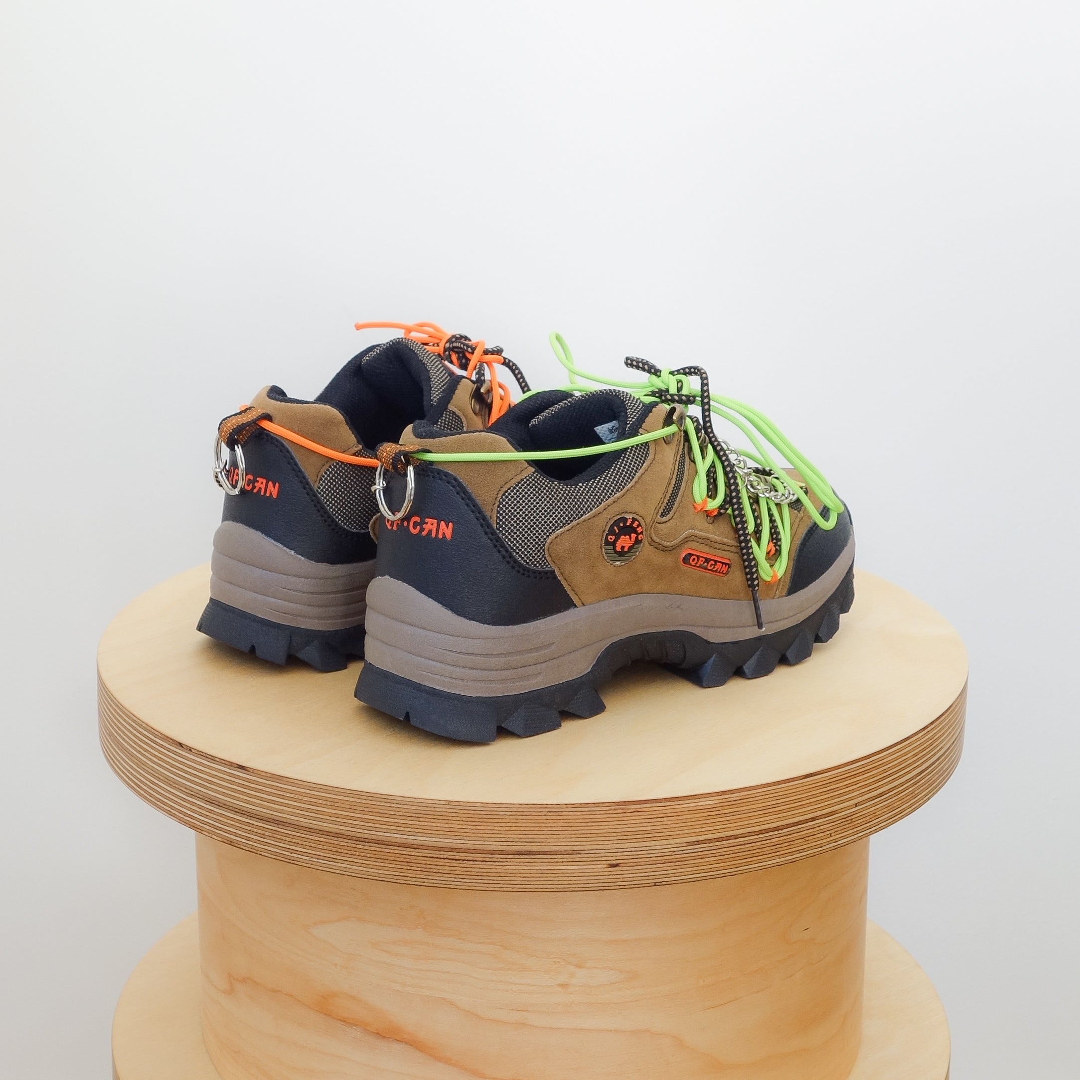 Low top hiking shoes with chains and orange and green laces in a unique pattern 10.5” x 4” x 4.5”