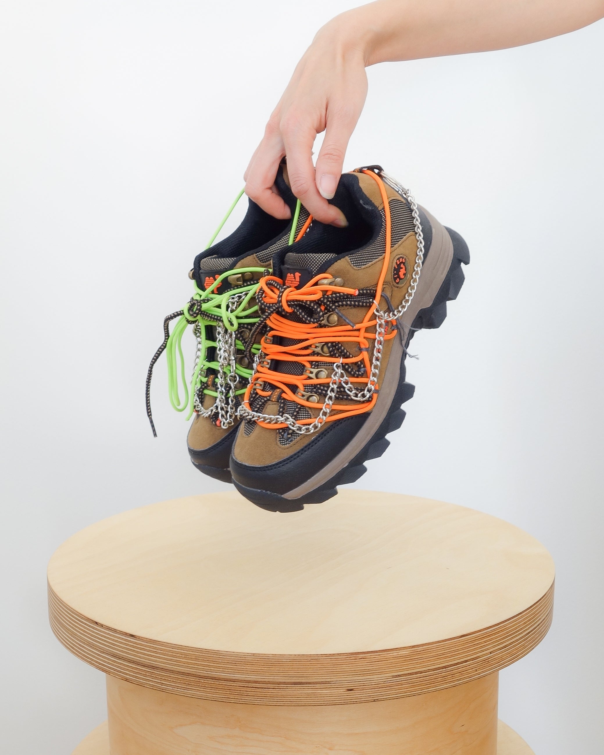 Low top hiking shoes with chains and orange and green laces in a unique pattern 10.5” x 4” x 4.5”